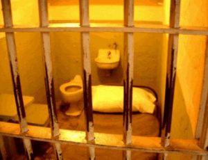 Jail cell in Georgia highlighting risk of incarceration for reckless driving