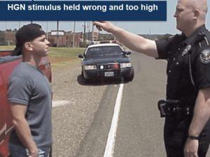 Officer performing horizontal gaze nystagmus test incorrectly during DUI stop