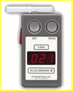 Alco-Sensor III portable breathalyzer showing a 0.21 reading, used during Georgia DUI roadside investigations