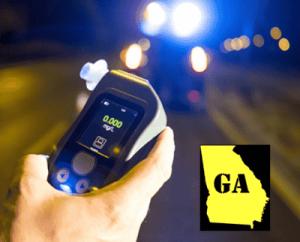 Close-up of a handheld portable breathalyzer test displaying 0.000 BAC with Georgia state icon in foreground