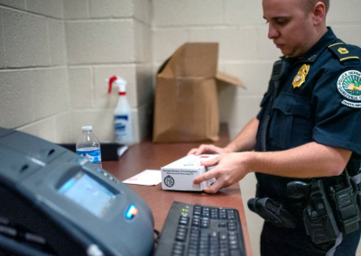 Police Officer Collecting Breath and Urine